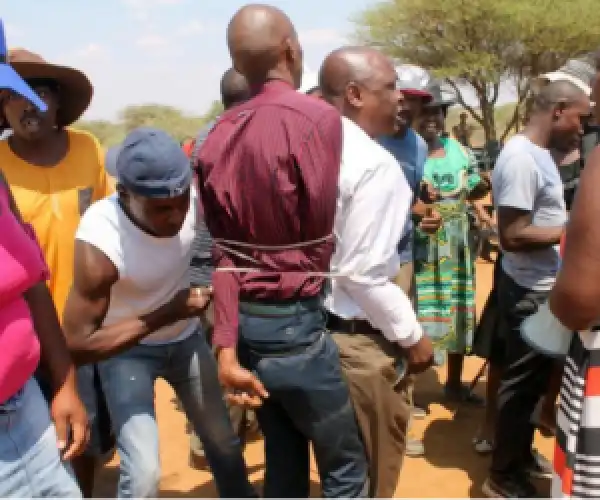 Photos: Pastor Who Makes Congregation Eat Snakes, Beaten & Tied, His Church Burnt Down